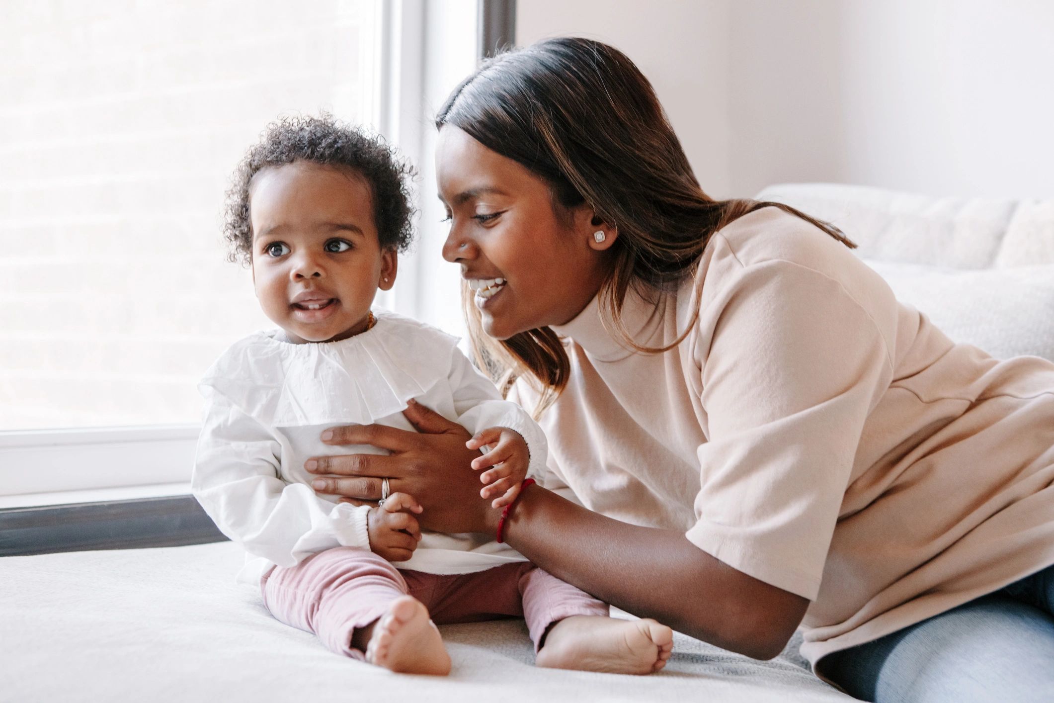 Caregiver and child sharing a warm moment at home
